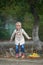 A child jumping in the puddle just after rain