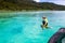 Child jumping into sea water. Yacht vacation