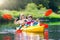 Child on kayak. Kids on canoe. Summer camping.