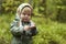 Child in a kerchief at the forest