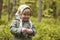 Child in a kerchief at the forest