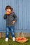 Child kid boy eating apple fruit full body portrait format autumn fall healthy