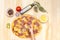 Child kid cooks pizza step by step. Various ingredients, raw dough, baby hands, homemade. On a wooden background