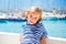 Child kid girl in marina boat on summer vacations