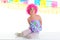 Child kid girl with party clown pink wig funny expression