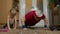 Child kid girl with senior grandfather in sportswear making sports workout push-up exercises at home