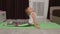 Child kid training gymnastics stretching workout at home, children girl making sport exercises