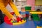 child in kindergarten, playroom, playing with toys, learning. Plays with