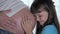 Child Kiss Mother Stomach Listens To How Baby Moves In Belly Of Pregnant Woman