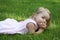 Child laying on grass