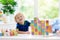 Child learning letters. Kid with wooden abc blocks