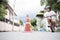 Child learning to ride a bicycle. By practicing riding around traffic cones