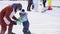 The child learns to ski with an instructor. Ski resort. Active sport