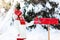 Child with letter to Santa at Christmas mail box in snow