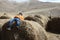 Child lies on bale of hay