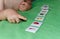 Child lining up toys on the floor at home. Kids education concept