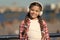 Child listen music outdoors modern headphones. Kid little girl listen song headphones. Music account playlist. Customize