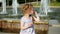 Child, Little Girl Eating Ice Cream on a Hot, Torrid Summer Day, Children near the fountain