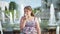 Child, little girl eating ice cream on a hot, torrid summer day, children near the fountain