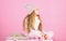 Child long hair warm woolen hat enjoy warm. Kid girl wear knitted warm hat relaxing pink background. Winter fashion warm