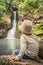 Child looking Chamouze waterfall. Mauritius