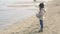 Child looking and gazing staring at the Sea in winter nostalgic scene