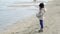 Child looking and gazing staring at the Sea in winter nostalgic scene