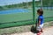 Child looking tennis court