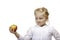 Child looks contemplative at healthy fruit (apple)