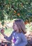 Child looks at a fresh picked Michigan apple