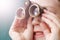 A child looks through theater binoculars