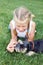 Child lovingly embraces his pet dog, a miniature schnauzer.