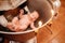 A child is lowered into the water in a font at a Christian baptism in the church