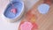 A child makes a craft for Valentine's Day. A close-up of the brush paints the heart pink. Gift. A pink heart on a