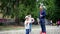 Child makes huge colorful bubbles, happy kids have fun with soap bubbles, outdoor acivities