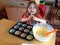 Child making cakes.