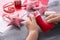 Child making felt Christmas toy at wooden table