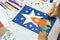Child making rocket and stars from paper. Creative children play with craft. The space theme development of children.  School