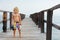 Child with mask, fins going to snorkel in tropical sea