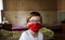 A child in a mask on inpatient treatment in a hospital