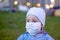 A child in a medical mask. Mask mode. A forced measure of protection. COVIDâ€“19