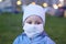 A child in a medical mask. Mask mode. A forced measure of protection. COVIDâ€“19