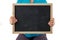 Child midsection holding an empty blackboard.