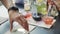 A child mixes colorful liquids in a chemical laboratory.