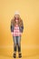 Child model with long blond hair smile and stand tiptoe
