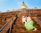 Child and Mom climbing on Shwesandaw pagoda in Bagan. Myanmar