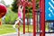 Child on monkey bars. Kid at school playground