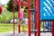 Child on monkey bars. Kid at school playground