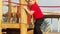 Child on monkey bars. Kid at school playground. Little boy hanging on gym activity center of preschool play ground