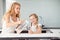 Child with mother drinking water